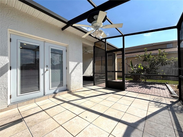 view of patio featuring french doors, ceiling fan, and a lanai