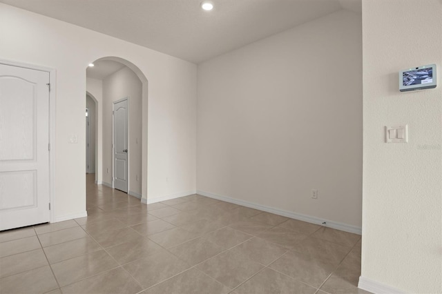 empty room with light tile patterned flooring