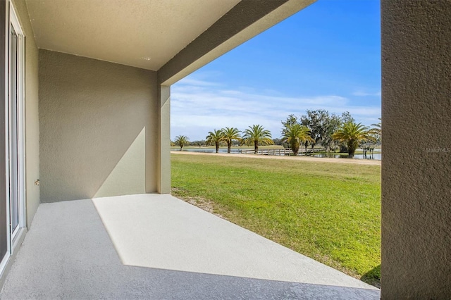 view of patio featuring a water view