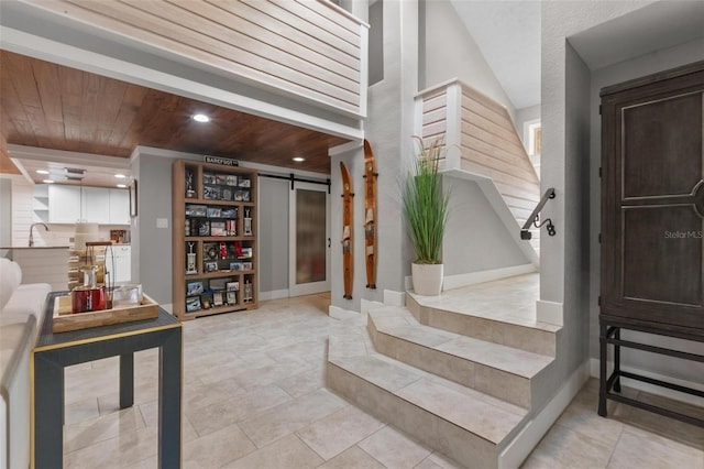 1 Casarena Ct, Winter Haven, FL 33881 - stairway featuring recessed lighting, a barn door, wood ceiling, and tile patterned flooring