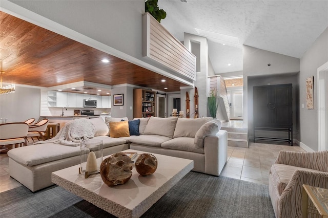 1 Casarena Ct, Winter Haven, FL 33881 - living area featuring baseboards, an inviting chandelier, recessed lighting, light tile patterned floors, and wood ceiling