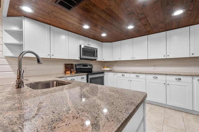 1 Casarena Ct, Winter Haven, FL 33881 - kitchen with wood ceiling, a sink, open shelves, and appliances with stainless steel finishes