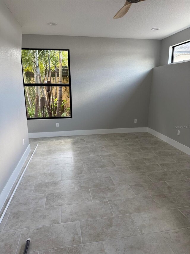 1 Casarena Ct, Winter Haven, FL 33881 - empty room featuring baseboards and a ceiling fan