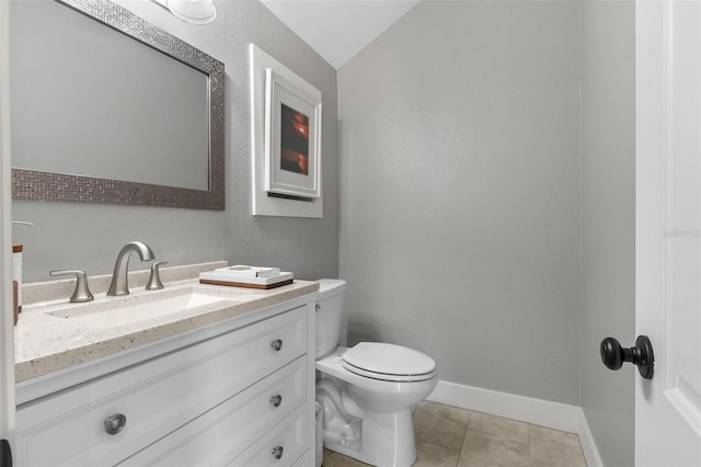 1 Casarena Ct, Winter Haven, FL 33881 - bathroom with vanity, vaulted ceiling, toilet, tile patterned floors, and baseboards