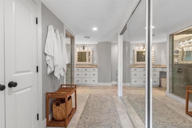 1 Casarena Ct, Winter Haven, FL 33881 - bathroom featuring a shower stall, vanity, baseboards, and recessed lighting