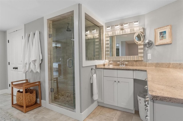 1 Casarena Ct, Winter Haven, FL 33881 - bathroom featuring a shower stall, tile patterned flooring, vanity, and baseboards