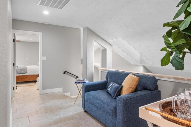 1 Casarena Ct, Winter Haven, FL 33881 - living area with baseboards, vaulted ceiling, recessed lighting, an upstairs landing, and visible vents