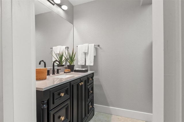 1 Casarena Ct, Winter Haven, FL 33881 - bathroom with tile patterned floors, baseboards, vanity, and a textured wall
