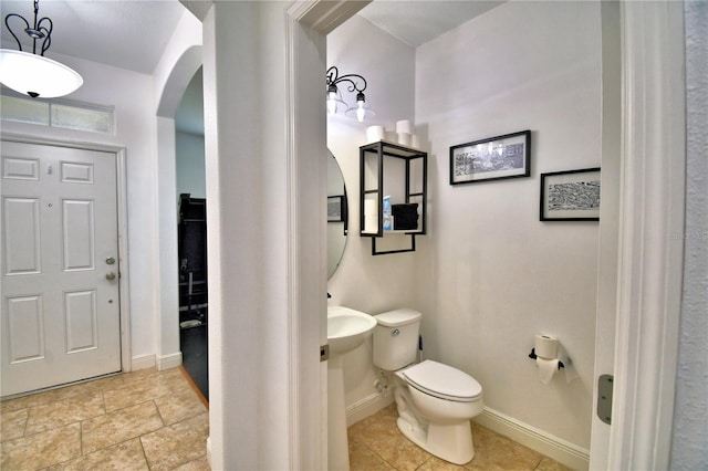 bathroom with tile patterned flooring and toilet