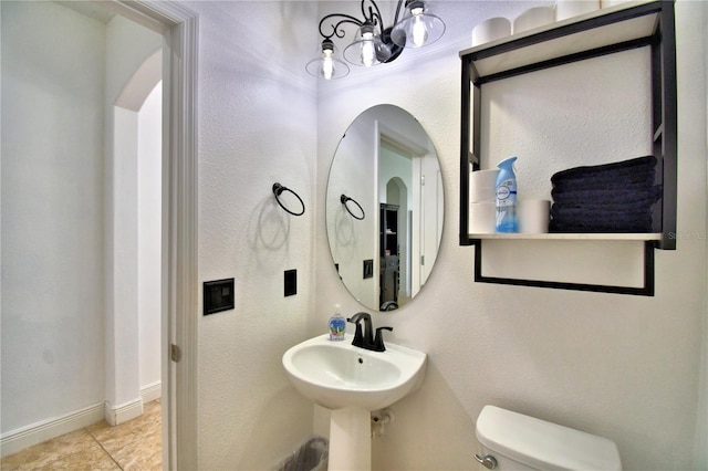 bathroom featuring tile patterned floors and toilet