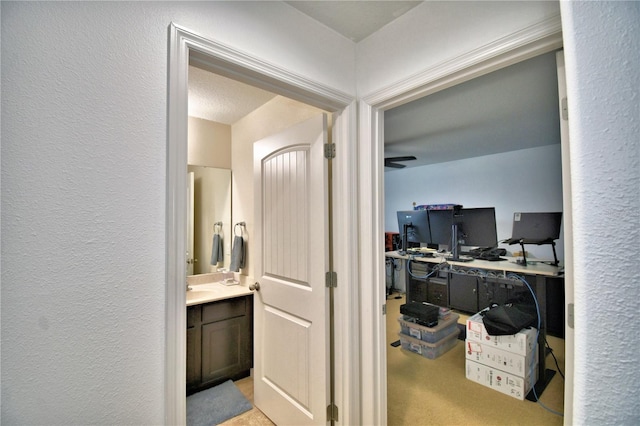 hallway with light colored carpet