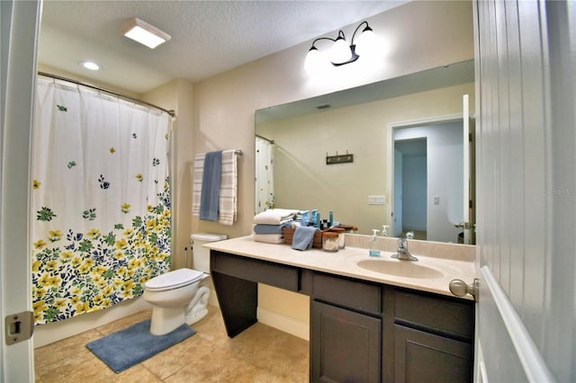 bathroom with tile patterned floors, toilet, a shower with curtain, a textured ceiling, and vanity