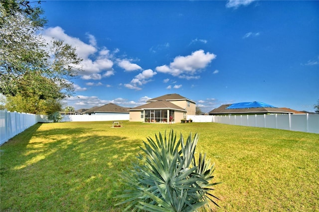 view of yard featuring a sunroom