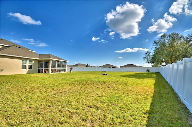 view of yard featuring a sunroom