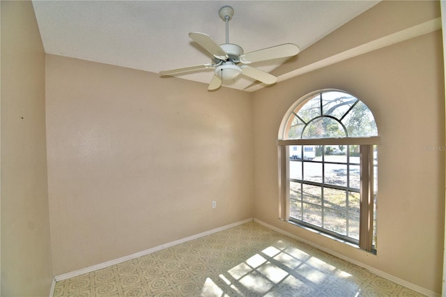 empty room with a wealth of natural light and ceiling fan