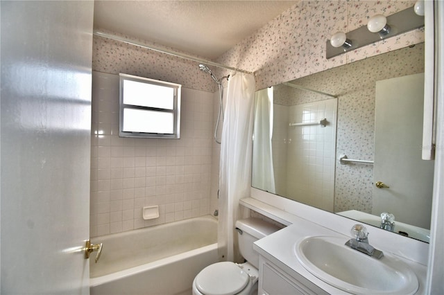 full bathroom with vanity, shower / bathtub combination with curtain, a textured ceiling, and toilet