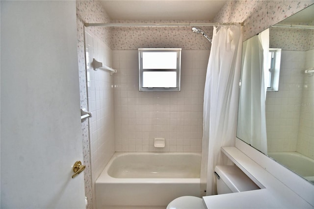 bathroom with shower / tub combo with curtain and toilet