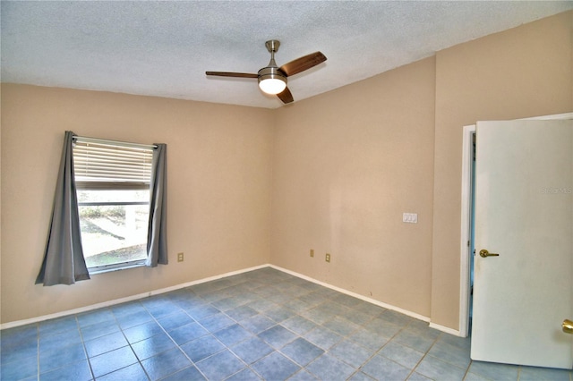 empty room featuring a textured ceiling and ceiling fan