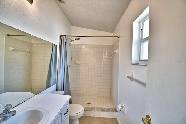 bathroom with tile patterned floors, toilet, vaulted ceiling, a textured ceiling, and a shower with shower curtain