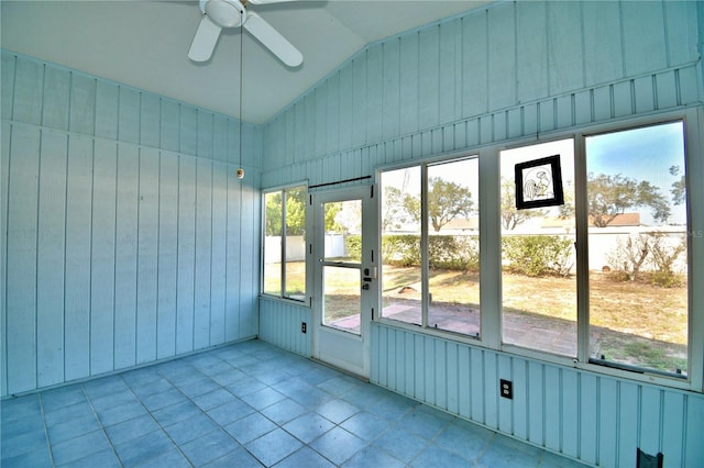 unfurnished sunroom featuring vaulted ceiling and ceiling fan