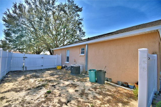 view of side of property with central AC unit