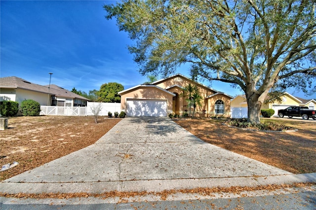 ranch-style home featuring a garage