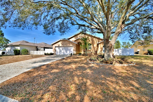 ranch-style home featuring a garage