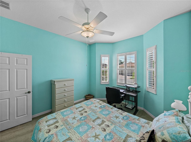 bedroom featuring ceiling fan and carpet floors