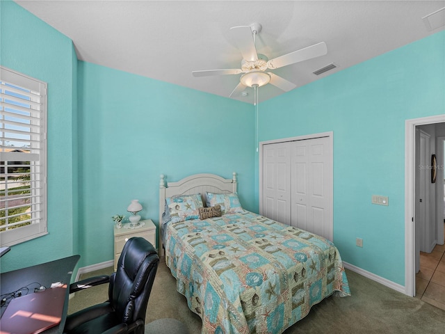 carpeted bedroom with a closet and ceiling fan