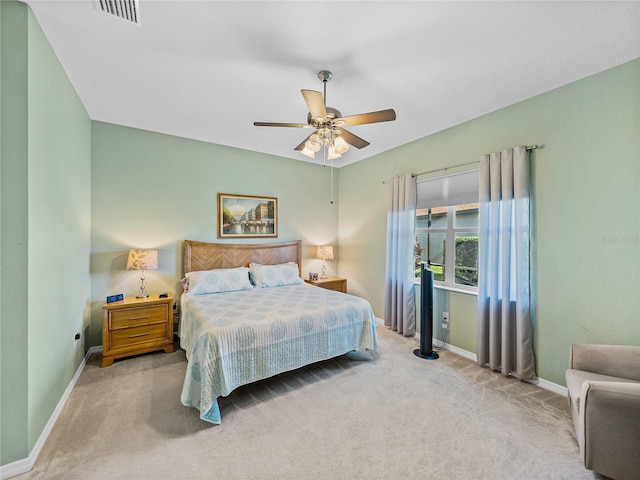 bedroom with light colored carpet and ceiling fan