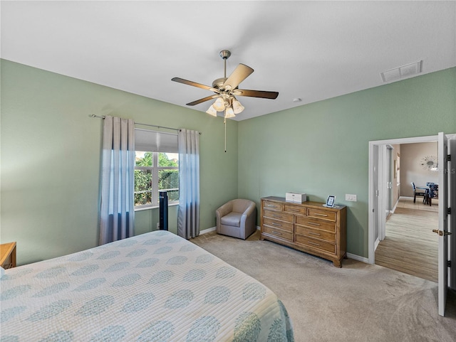 bedroom with light colored carpet and ceiling fan