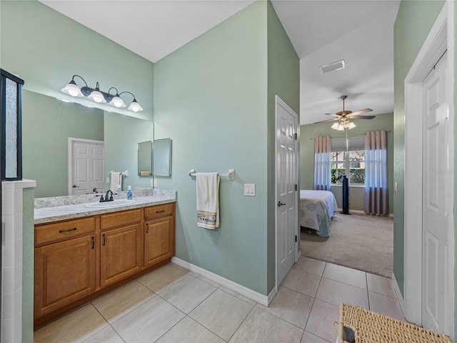 bathroom featuring ceiling fan, tile patterned floors, and vanity