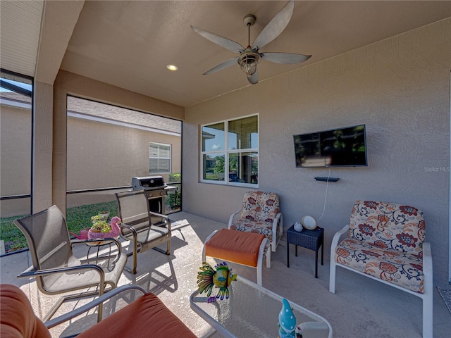 view of patio featuring an outdoor hangout area and ceiling fan