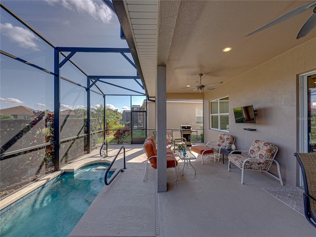 view of pool featuring ceiling fan, a patio area, and glass enclosure