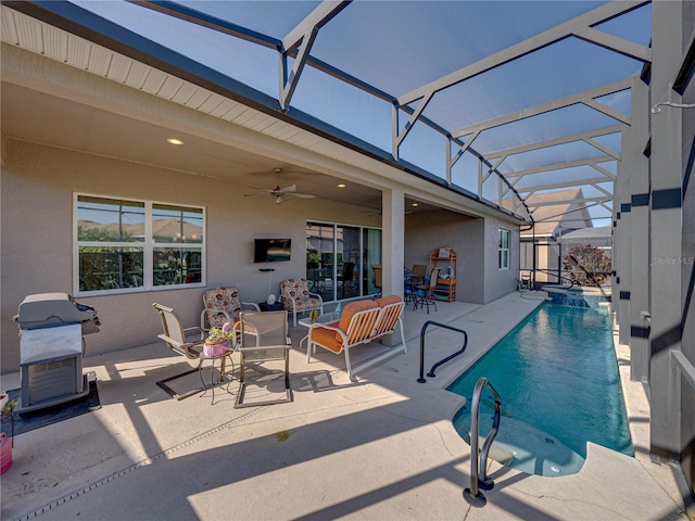 view of pool featuring ceiling fan, outdoor lounge area, a patio, glass enclosure, and area for grilling