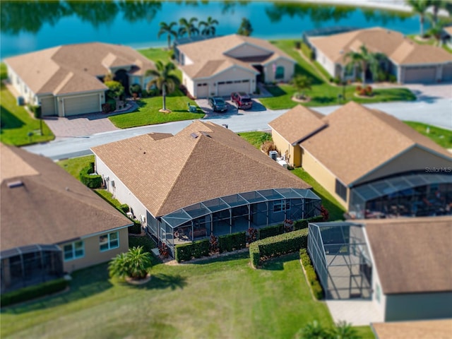 drone / aerial view with a water view