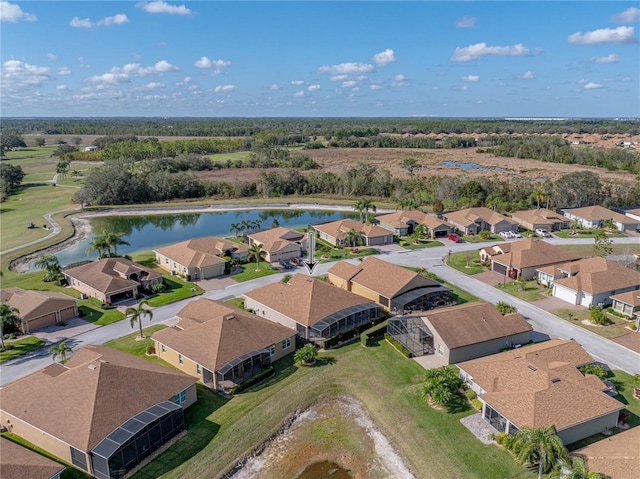 bird's eye view with a water view