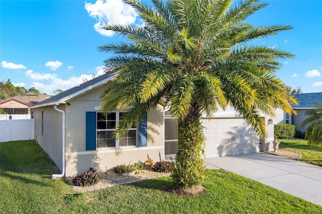 view of front of property featuring a garage and a front yard