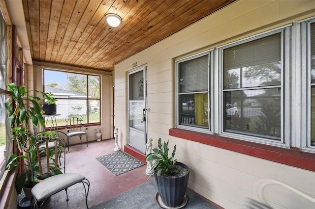 sunroom with wooden ceiling