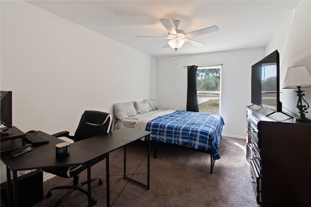 bedroom with ceiling fan and dark carpet