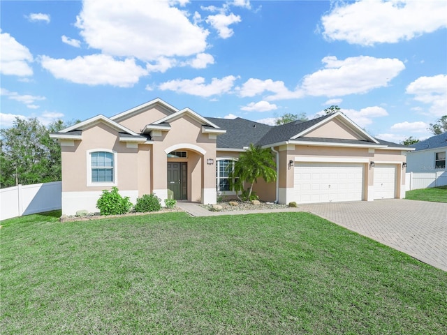 ranch-style house with a garage and a front yard