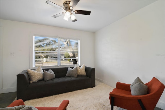 living room featuring ceiling fan and carpet flooring