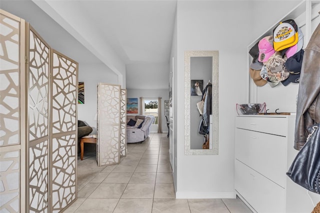 hallway with light tile patterned floors