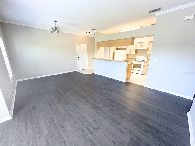 unfurnished living room with crown molding, dark hardwood / wood-style floors, and a chandelier