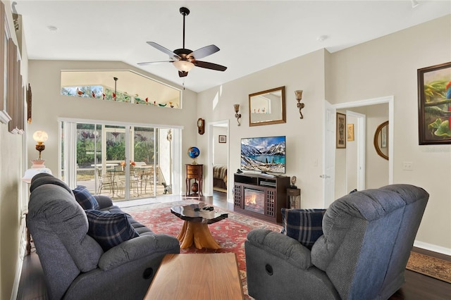 living room featuring ceiling fan, wood-type flooring, and vaulted ceiling