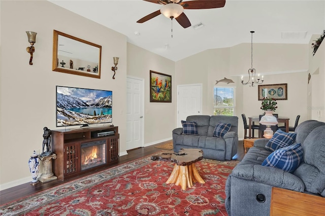 living room featuring ceiling fan with notable chandelier, high vaulted ceiling, and dark hardwood / wood-style floors