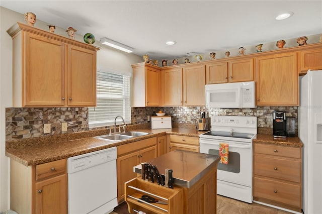 kitchen featuring sink, light brown cabinets, white appliances, and decorative backsplash