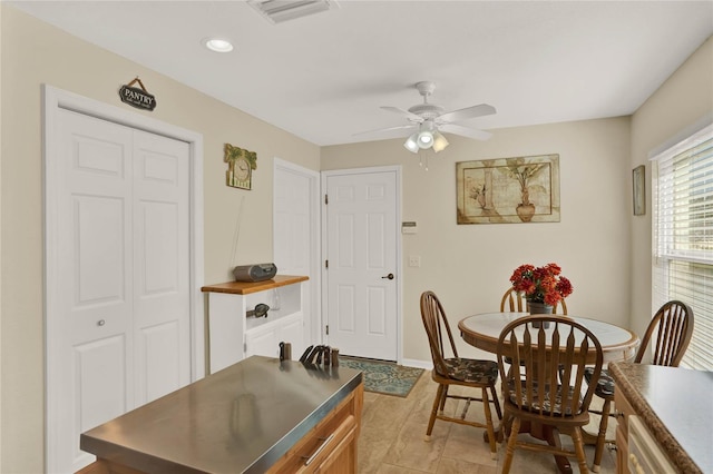 dining room with ceiling fan