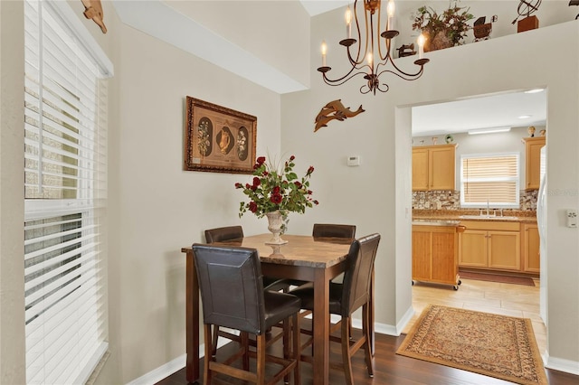 dining area with sink and light hardwood / wood-style flooring