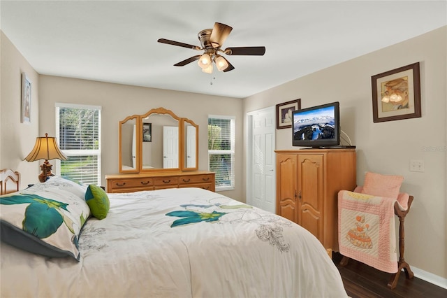 bedroom featuring ceiling fan and dark hardwood / wood-style floors